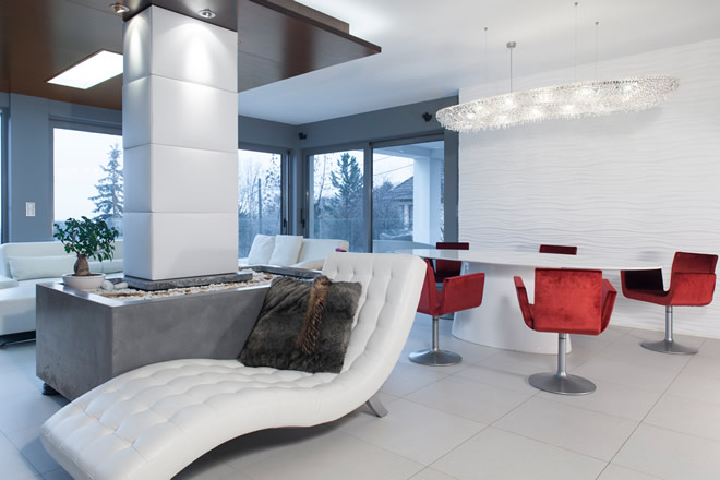 Our Atoll crystal chandelier is hanging above the dining table in this very modern environment in a private residence in Budapest, Hungary.